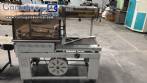 Automatic L-sealer with shrink tunnel.