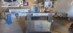 Automatic self-adhesive labeling machine for cylindrical bottles