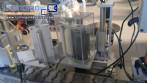 Automatic self-adhesive labeling machine for cylindrical bottles