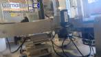 Automatic self-adhesive labeling machine for cylindrical bottles