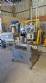 Automatic self-adhesive labeling machine for cylindrical bottles