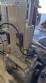 Automatic self-adhesive labeling machine for cylindrical bottles