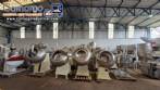 Set of ten stainless steel coating pans with capacities between 150 liters and 350 liters