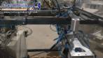 Pick and place product feeder for flowpack transfer cartoning machine