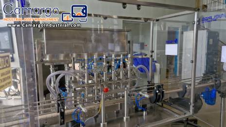Complete filling line with Tecman Nelpas Tecnoenvase Tudela bottle filling, labeling, capping, and positioning machines for cosmetic liquids.