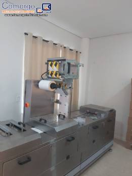 Automatic thermoforming machine with two lanes