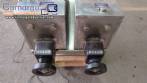Filling machine with 2 nozzles for liquids and pilfer cap screwer