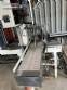 Automatic baling machine with shrink tunnel for bottles and jars in bales.