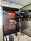 Packaging line with IMSB bung capper, Maqmundi labeler and accumulator table