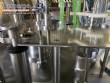 Gravimetric rotary filling machine in stainless steel with cabin