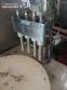 Erli rotary liquid filling machine with 4 pistons, 14,400 units per hour.