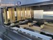 Filling line for 10 and 20 liter gallon jugs with filling machine and rinser/washer.
