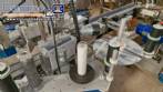 Automatic double-head labeling machine for cylindrical and flat bottles, Tudela, 3,000 labels per hour.