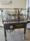 Adhesive tape case sealer with safety enclosure and door sensors Strapack
