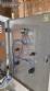 Labeling machine with steam sleeve tunnel and bottle baler