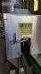 Labeling machine with steam sleeve tunnel and bottle baler