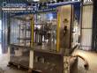 Zegla rotary filling machine with rinser and three-block capping system.