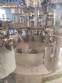 Zegla rotary filling machine with rinser and three-block capping system.