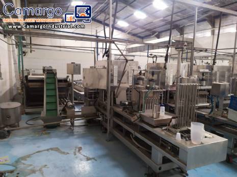 Automatic filling and sealing machine for gelatin cups, 12,000 units/hour.