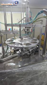 Rotary filling machine with capping and sealing unit for Mirainox cups and jars for pasty products.