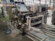 Continuous line laminator, cutter and folder for long dry pasta (tagliatelle).