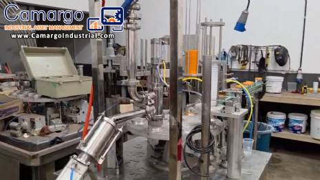 Rotary filling and dosing machine with capping and sealing unit for cups and bottles, capacity 2,000 units. Rotary filling and dosing machine with capping and sealing unit for cups and bottles, capacity 2,000 units.
